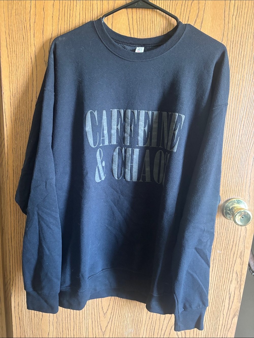 Jerzees Black Crewneck Sweatshirt with 'CAFFEINE & CHAOS' Print
